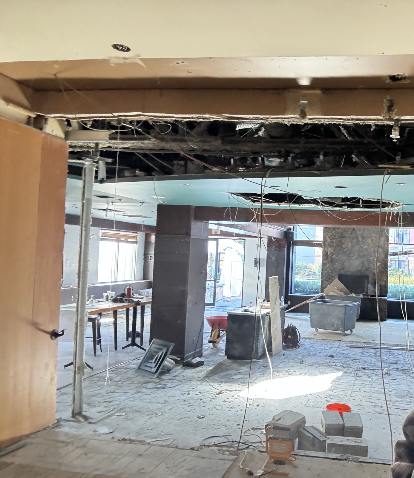 Interior commercial demolition site with exposed structural elements